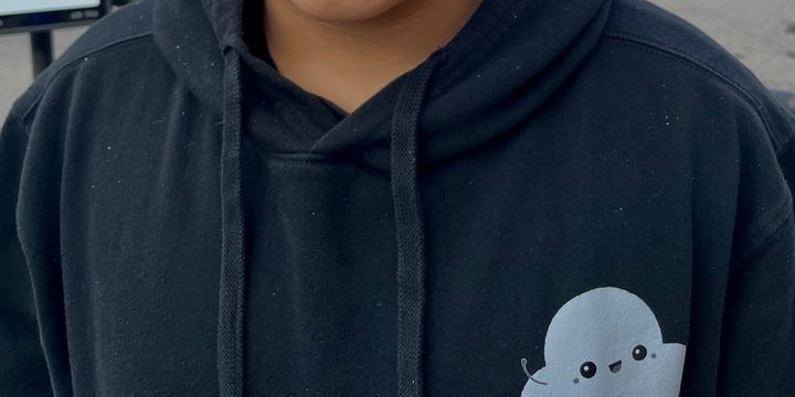A black Forever Pop-In hoodie with the What's Pop-In logo